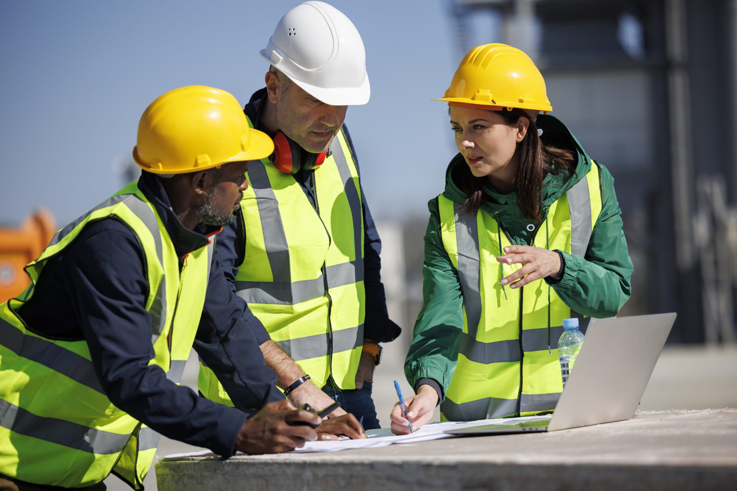 Health and safety consultant meeting team on construction site